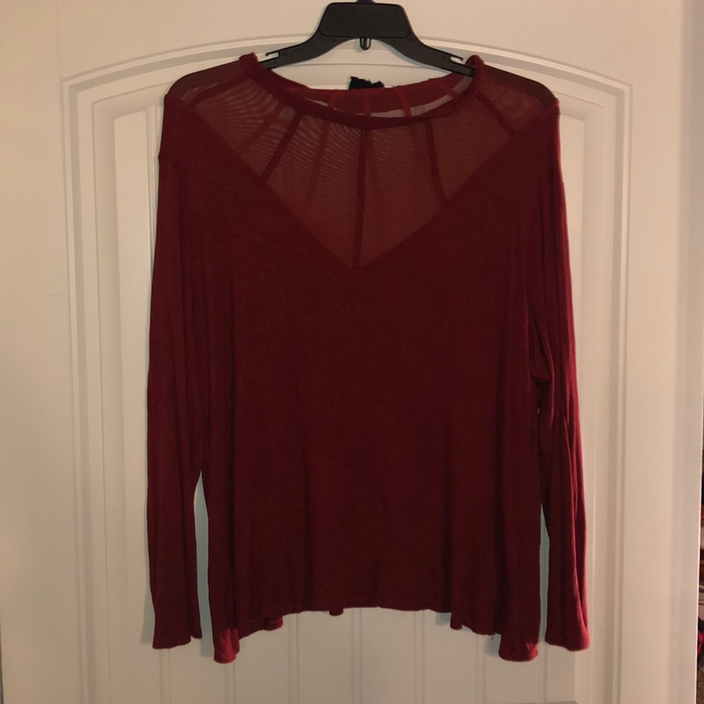 Long sleeve rust colored top with mesh detail